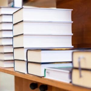 A close up of several books on a shelf