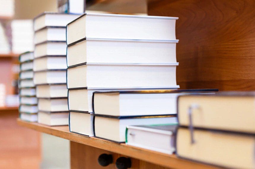 A close up of several books on a shelf