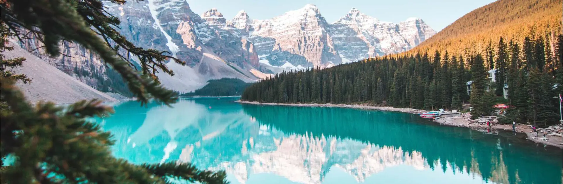 A lake with mountains in the background