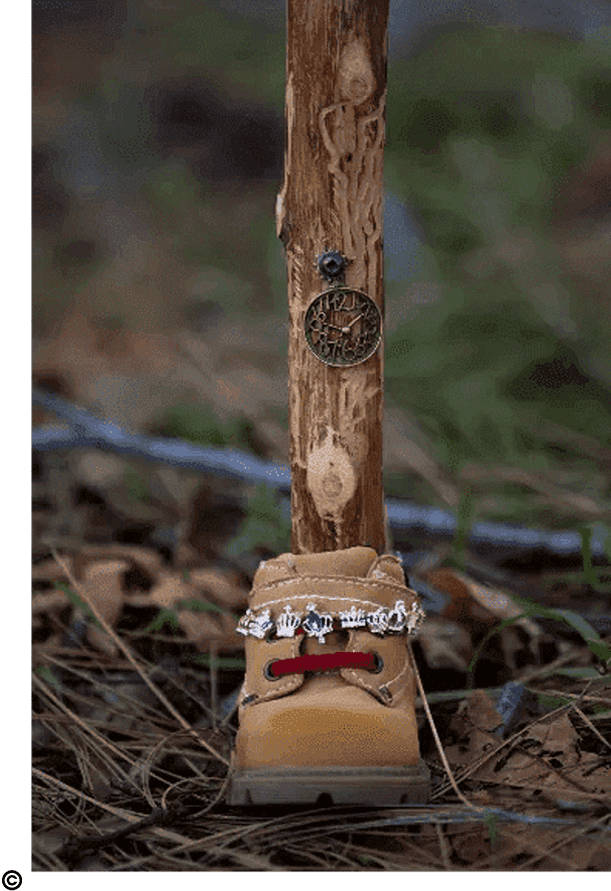 A wooden stick with a clock on it